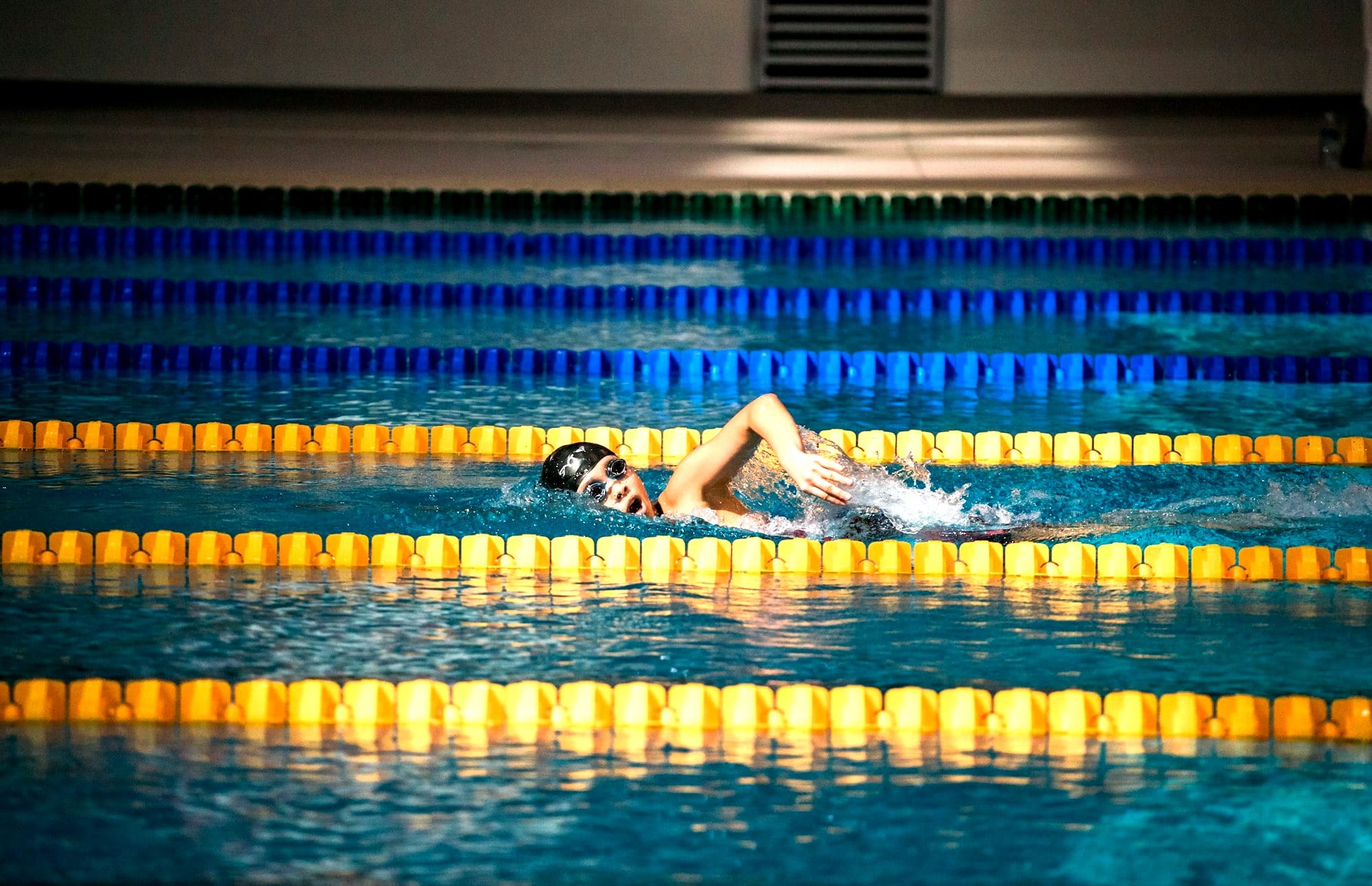person diving in pool
